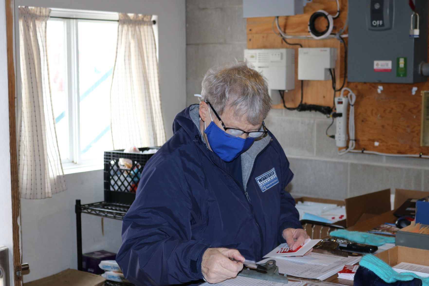Bonnie Nyhus Checking Food Orders.JPG (copy)